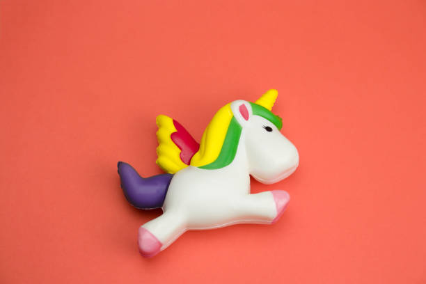 istock squishy unicorn toy on a coral background 1129380661
