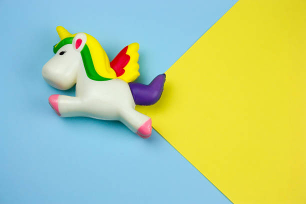 istock unicorn squishy toy on a blue and yellow background 1129381008