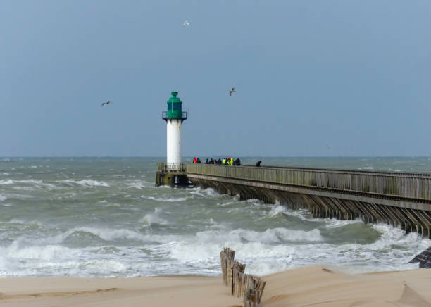 istock Calais France seaside with gale winds with warf 1129381505