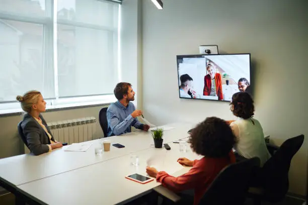 Photo of Business People Having a Video Call