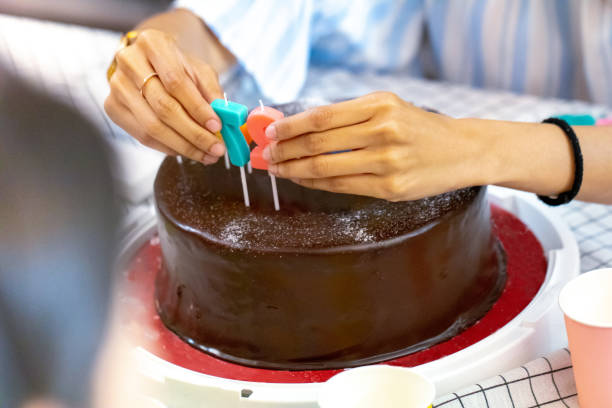 Decorative candles on chocolate cake.