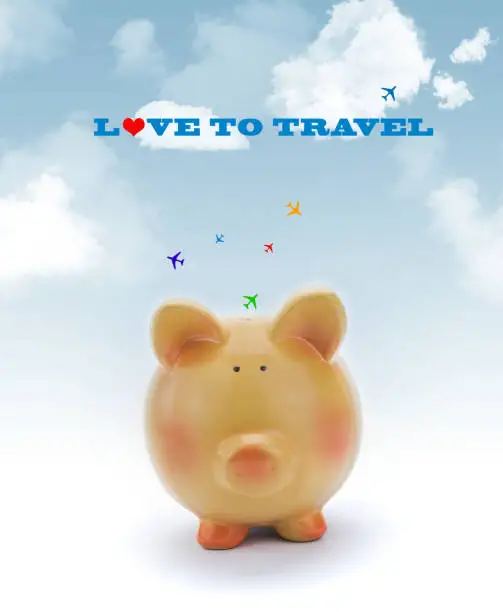 Piggy bank with blue sky and jets flying above