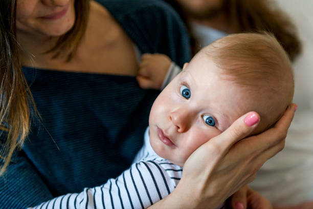 istock Beautiful baby with mom 1129384715