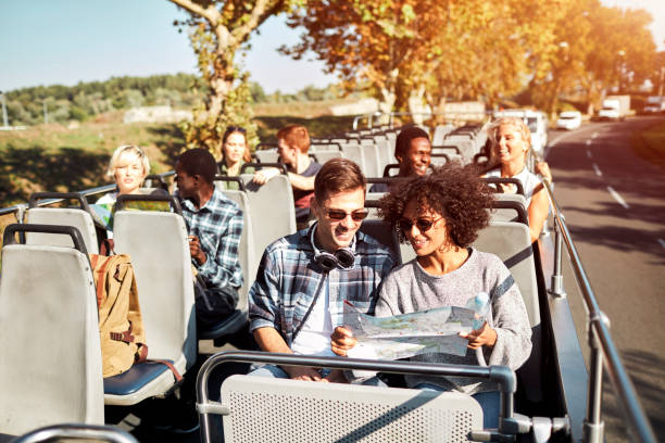 istock Open Top Bus Tour In The City 1129384780