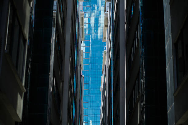 istock Looking on full glass building between two office buildings in downtown KL 1129385203
