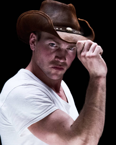 istock Attractive cowboy wearing white tshirt 1129387626