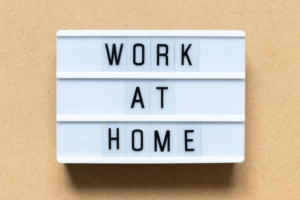 istock White lightbox with word work at home on wood background 1129388175