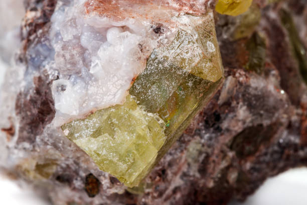 istock Macro mineral stoneGolden Apatite on a white background 1129389769