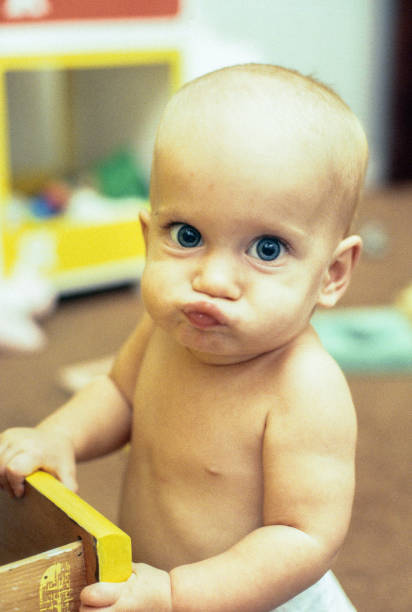 istock Infant girl with funny expression 1129390188