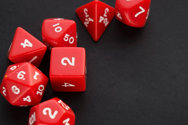 istock Set of red dices for board, tabletop or rpg games on black background. 1129391489