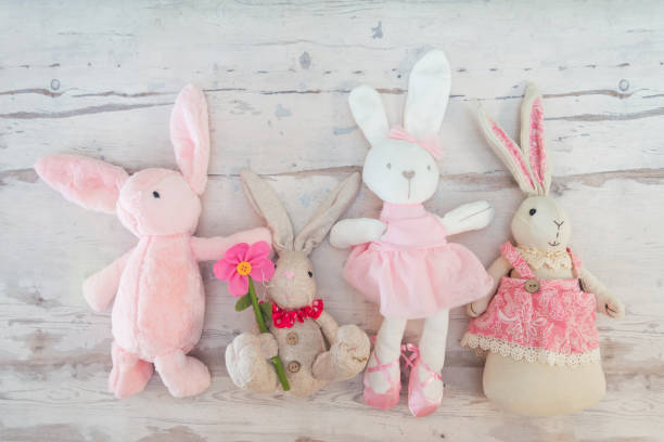 istock Easter rabbit and eggs with colorful eggs around and white background 1129391690