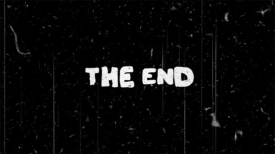 The end white text on black with film noise