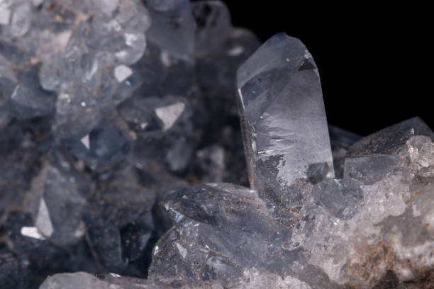 istock Celestine mineral stone macro on microcline on black background 1129396946