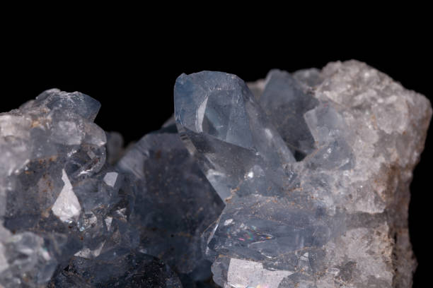 istock Celestine mineral stone macro on microcline on black background 1129398169