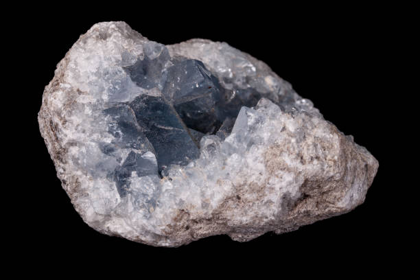 istock Celestine mineral stone macro on microcline on black background 1129398553