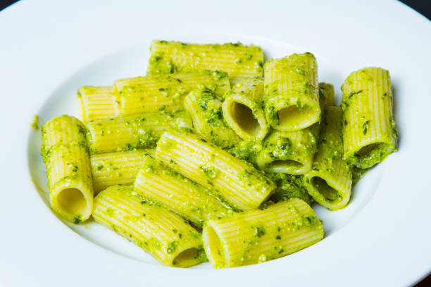 Italian Pasta Green Pesto Varied Italian Pasta comida italiana stock pictures, royalty-free photos & images