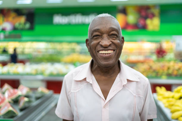 Afro latinx senior man portrait at supermarket portrait People at supermarket afro latinx ethnicity stock pictures, royalty-free photos & images