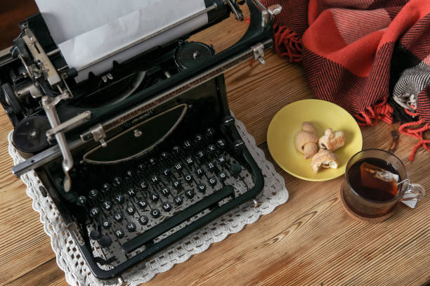Workplace old school writer with tea and typewriter