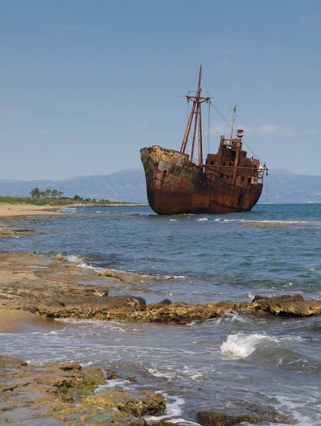 Rusty wreck of a ship, at a beautiful beach.