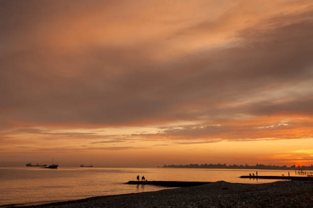 istock Seascape with fishermen. 1129406238