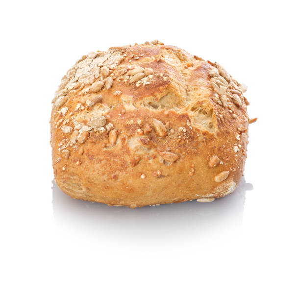 istock Whole grain roll with sunflower seeds white isolated 1129408945