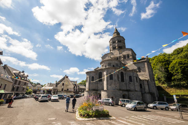 Orcival, Brittany, France Orcival, France. The Basilique Notre-Dame (Our Lady Basilica), a Roman catholic Romanesque church in Auvergne orcival stock pictures, royalty-free photos & images