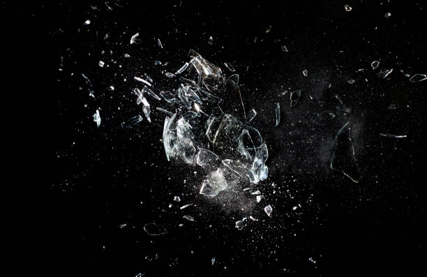 istock Glass Breaking Against Black Background 1129412279