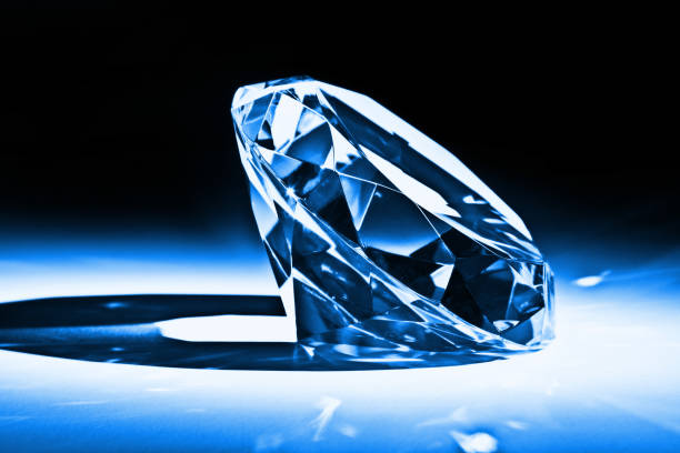 istock Close-Up Of Diamond On Table Against Black Background 1129412284