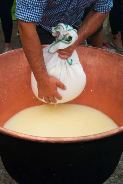 istock Step of separation milk to cheese in a copper cauldron 1129413555