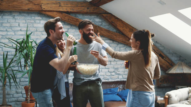 istock Girl feeding her friend with popcorn 1129414551