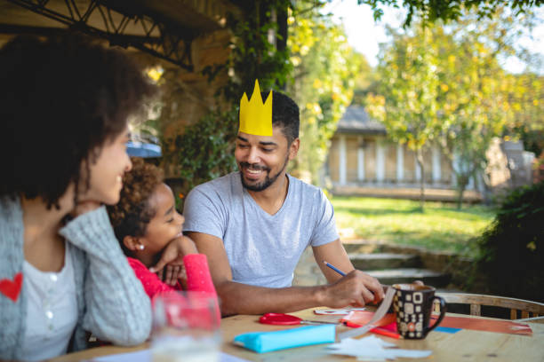 istock Lovely family having fun while doing a art project for school 1129414554