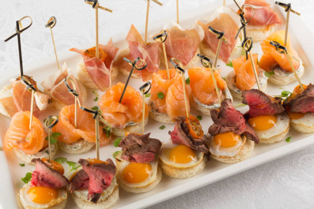 istock Festive Appetizer with quail egg, salmon and roast beef 1129414596