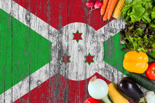 Fresh vegetables from Burundi on table. Cooking concept on wooden flag background.