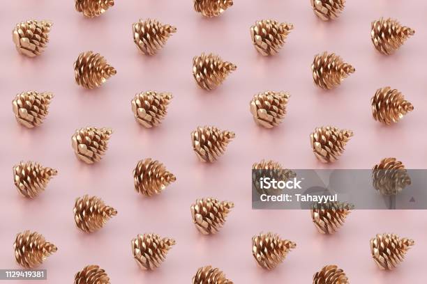 Golden Pine Cones On Pastel Pink Background Stock Photo - Download Image Now - Christmas, Modern, Pine Cone