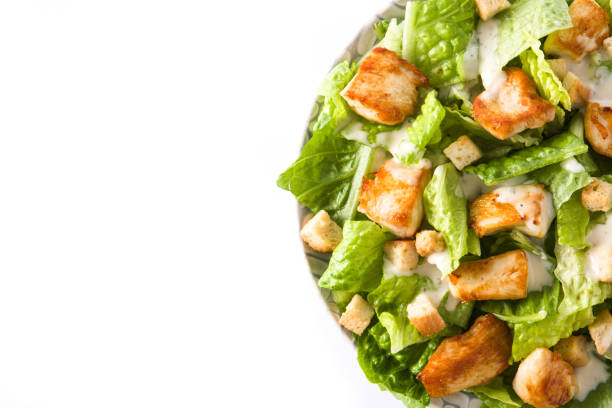 istock Caesar salad with lettuce,chicken and croutons 1129419615