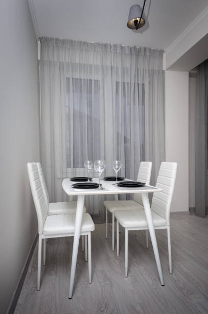 istock Modern white and gray living room with dining table 1129419752