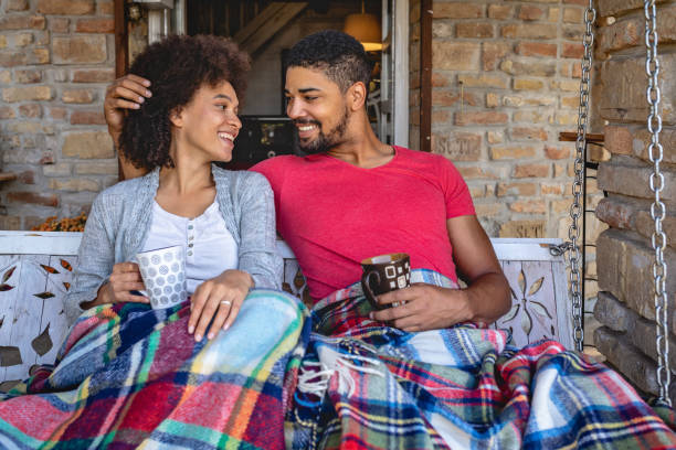 istock Lovely romantic couple on a porch swing 1129419797