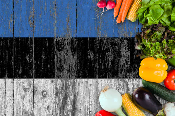 istock Fresh vegetables from Estonia on table. Cooking concept on wooden flag background. 1129420165