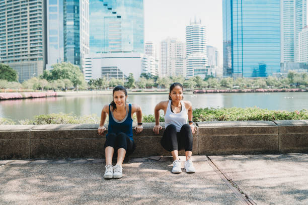 Young women exercising together outdoor