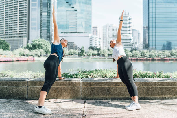 istock Young women exercising together at the park 1129423983