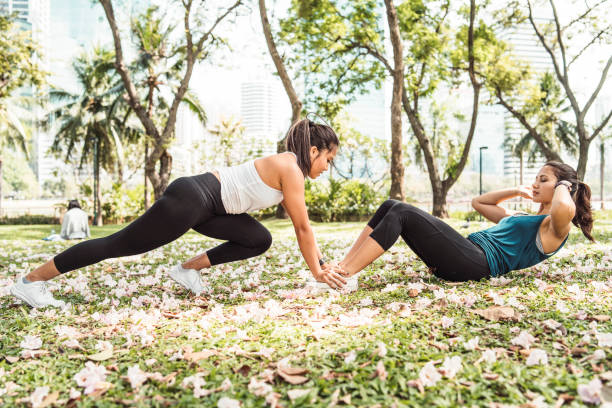 istock Young women training together at the park 1129424013