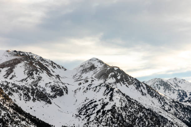 istock Sunrise in high mountain snowy landscape 1129424666