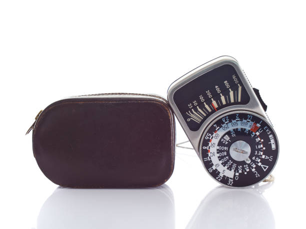 istock Vintage exposure light meter with leather case on white background 1129425515