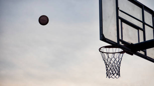 istock Basketball flying into the hoop 1129425860