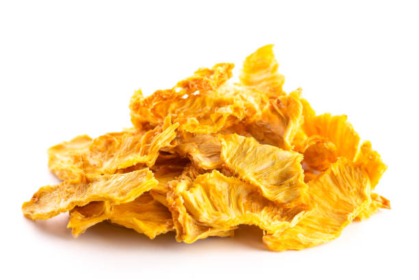 istock A PIle of Dried Pineapple on a Wooden Table 1129426062