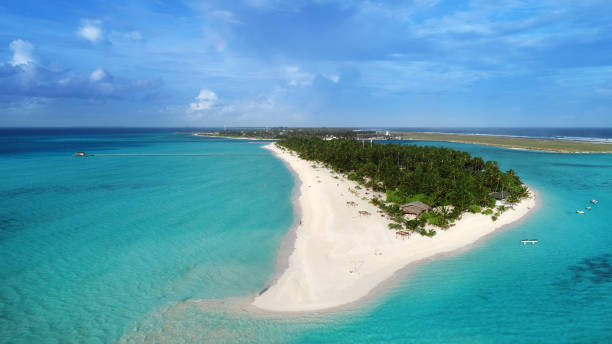 istock beach with water bungalows at Maldives 1129427516