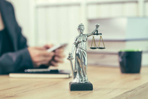 istock Attorney woman texting on mobile phone 1129431281