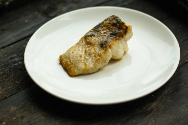istock Fish, fried seafood (white fish on the plate). Food background 1129431334