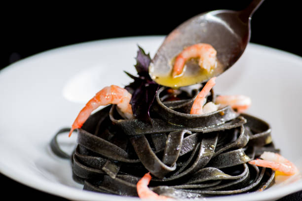 istock Italian black pasta with seafood 1129434215