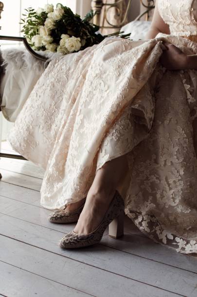 istock bride in wedding dress and shoes 1129440565